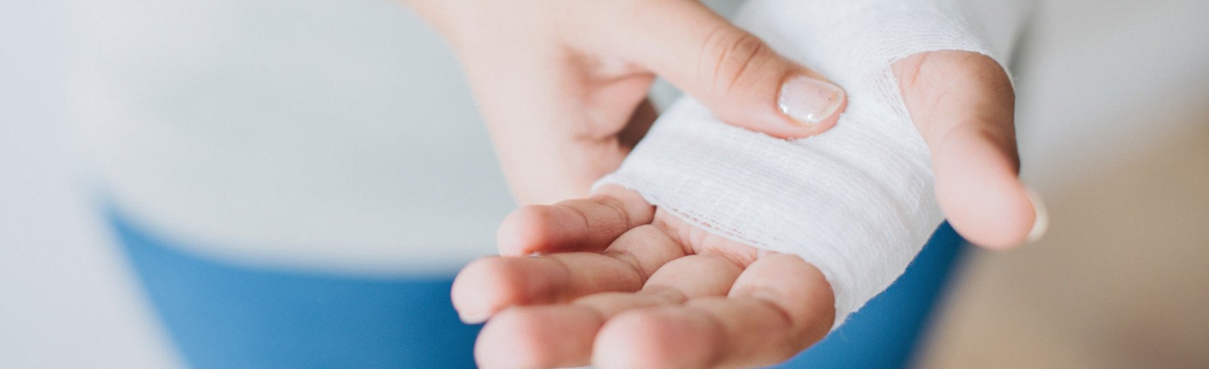 Patient bandaging a minor wrist strain